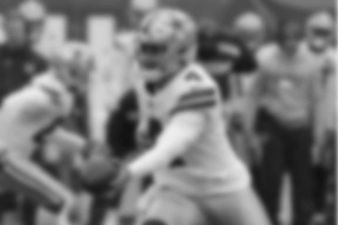 Dallas Cowboys quarterback Dak Prescott hands off the ball during the first half of an NFL football game against the New York Giants, Sunday, Dec., 30, 2018, in East Rutherford, N.J. (AP Photo/Bill Kostroun)