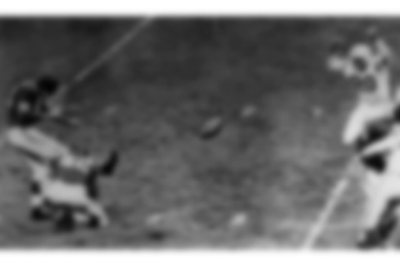 New York Giants' Pat Summerall kicks for 28 yards and a field goal with less than three minutes to play Nov. 9, 1958, to win the game against the Baltimore Colts in New York's Yankee Stadium. Holiding for the kick is Charley Conerly. Giants won 24-21. Colts, right, are halfback Milt Davis (20), and Andy Nelson (80). Summerall also kicked the three points after touchdown for the Giants. (AP photo/Harry Harris)