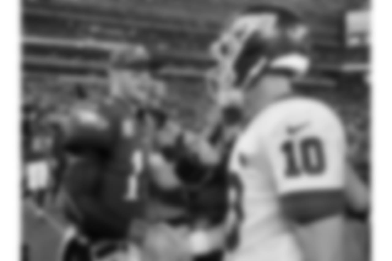 Philadelphia Eagles quarterback Carson Wentz (11) shakes hands with New York Giants quarterback Eli Manning (10) after an NFL football game Thursday, Oct. 11, 2018, in East Rutherford, N.J. The Eagles won 34-13. (AP Photo/Bill Kostroun)