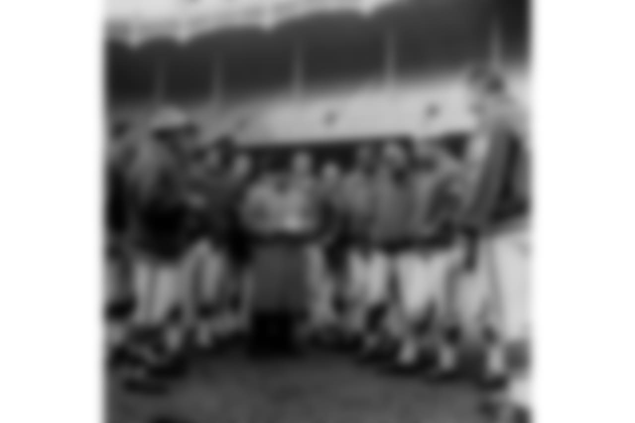 Baltimore Colts head coach Weeb Ewbank briefs his team for the next day's title game against the New York Giants at Yankee Stadium in New York in this Dec. 27, 1958 photo. (AP Photo)