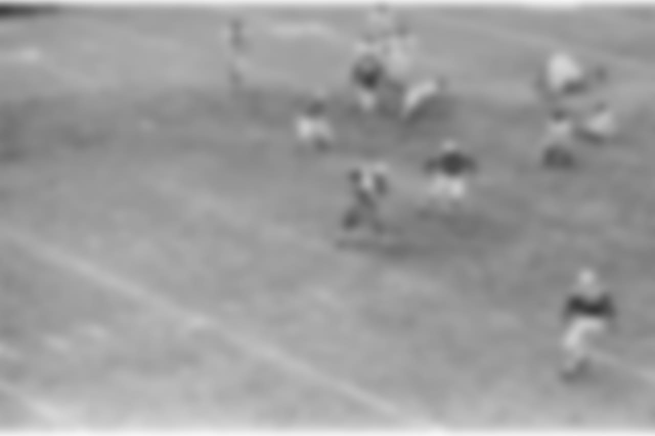 Johnny Sample of the Baltimore Colts knocks the ball away from Bob Schnelker of the New York Giants, during third period of title game in Baltimore, Md., Dec. 27, 1959. As ball bounds away, fellow Colts chase it. Colts are: Dick Szymanski (52) and Don Shinnick (66). Giants are: Rosey Brown (79) and Frank Gifford (16). (AP Photo)
