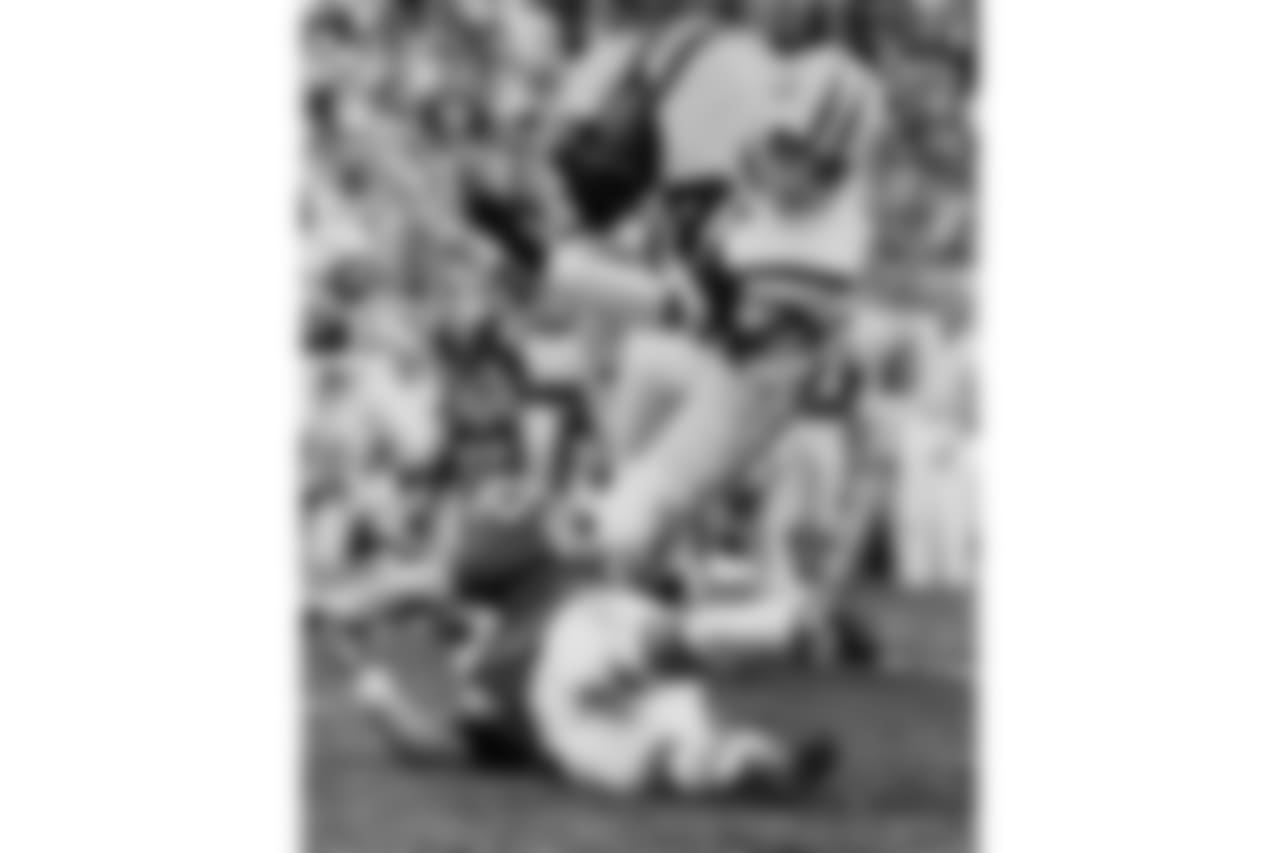 New York Jets fullback Matt Snell almost loses the ball as he is hit by Colts linebacker Dennis Gaubatz in the first quarter of Super Bowl III, Jan. 12, 1969 in Miami. (AP Photo/Harold Valentine)