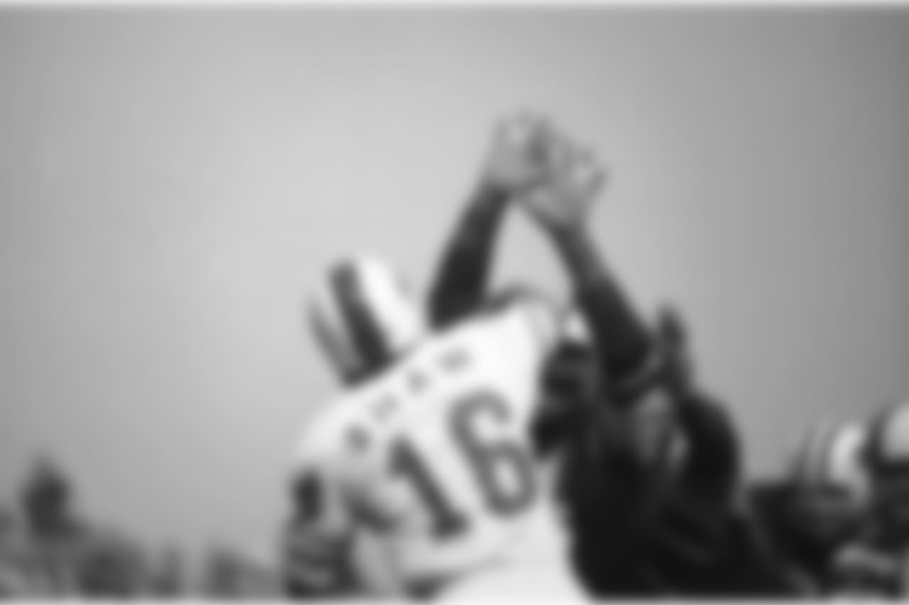 Buffalo Bills quarterback Dennis Shaw (16), throws beyond the up-stretched hands of New York Jets guard Andy Fusco, but the pass was incomplete, Oct. 17, 1971. The action took place during the first quarter of an AFC game at Yankee Stadium in Bronx, New York. The Jets won, 28-17. (AP Photo/Ron Frehm)