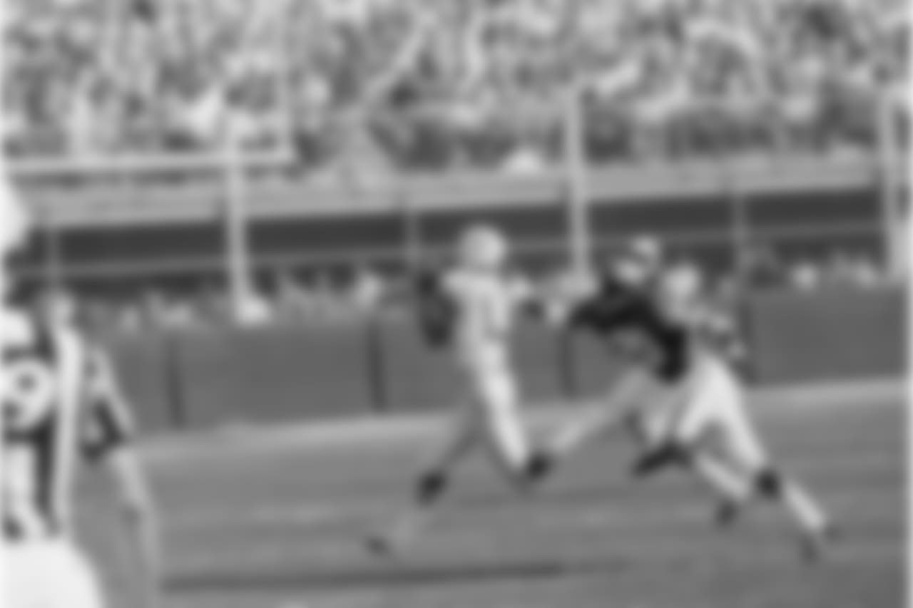Don Maynard (13) of the New York Jets, gathers in a pass from Joe Namath, good for 56 yards, and scampers for the Jets first touchdown in the AFL game at Kansas City, Sept. 15, 1968. Reaching out for Maynard is Goldie Sellers (20). The Jets edged out the Chiefs, 20-19. (AP Photo/William P. Smith)