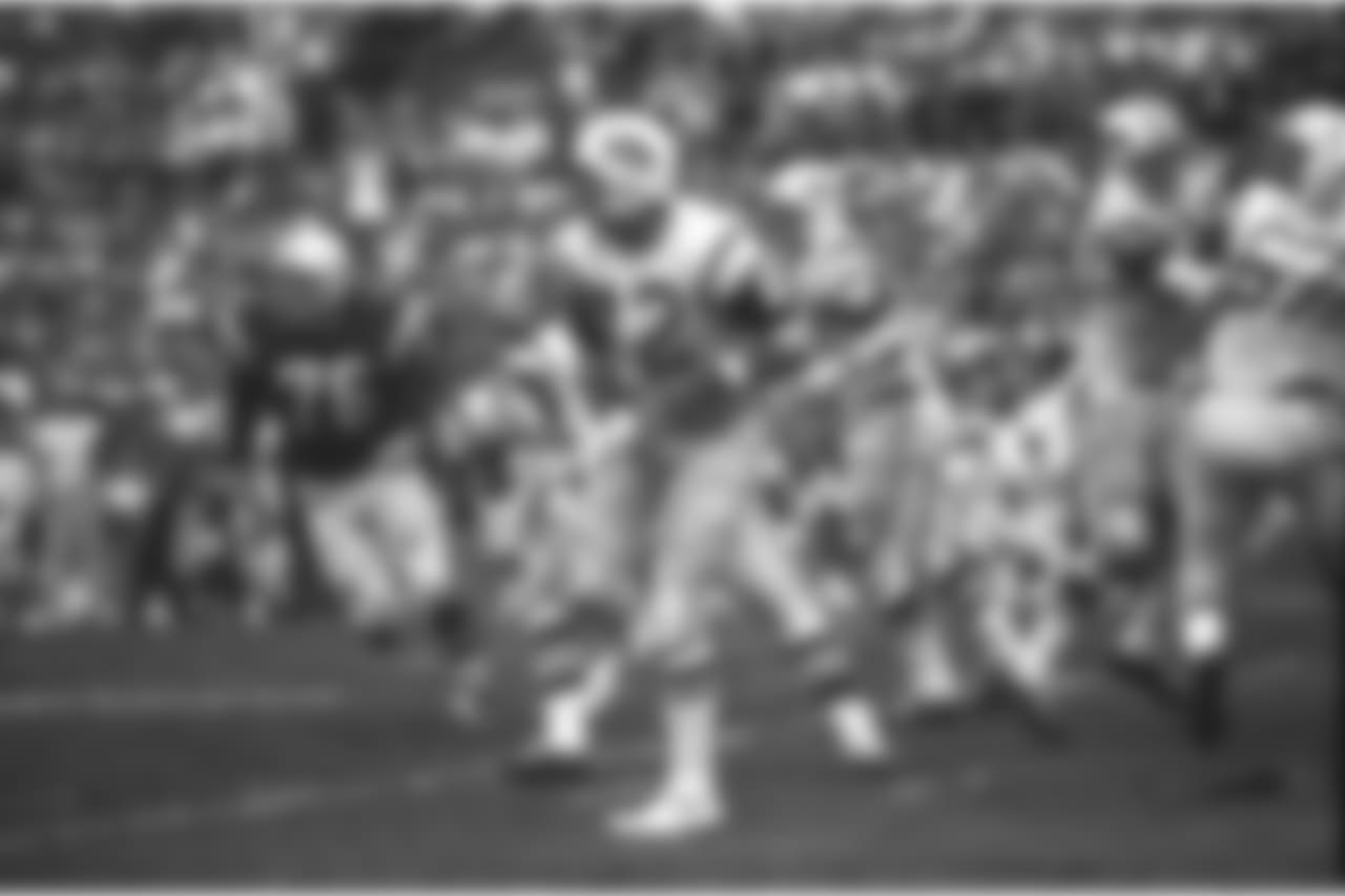New York Jets quarterback (12) Joe Namath gets off a pass under pressure from the Baltimore Colts defenders during Super Bowl III in Miami, Fla., on Sunday, Jan. 12, 1969. (AP Photo)