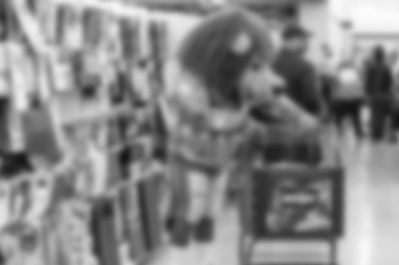 Roary shops with students from Detroit Lions Academy at Shop with a Lion at Meijer on Tuesday, Dec. 4, 2018 in Detroit.