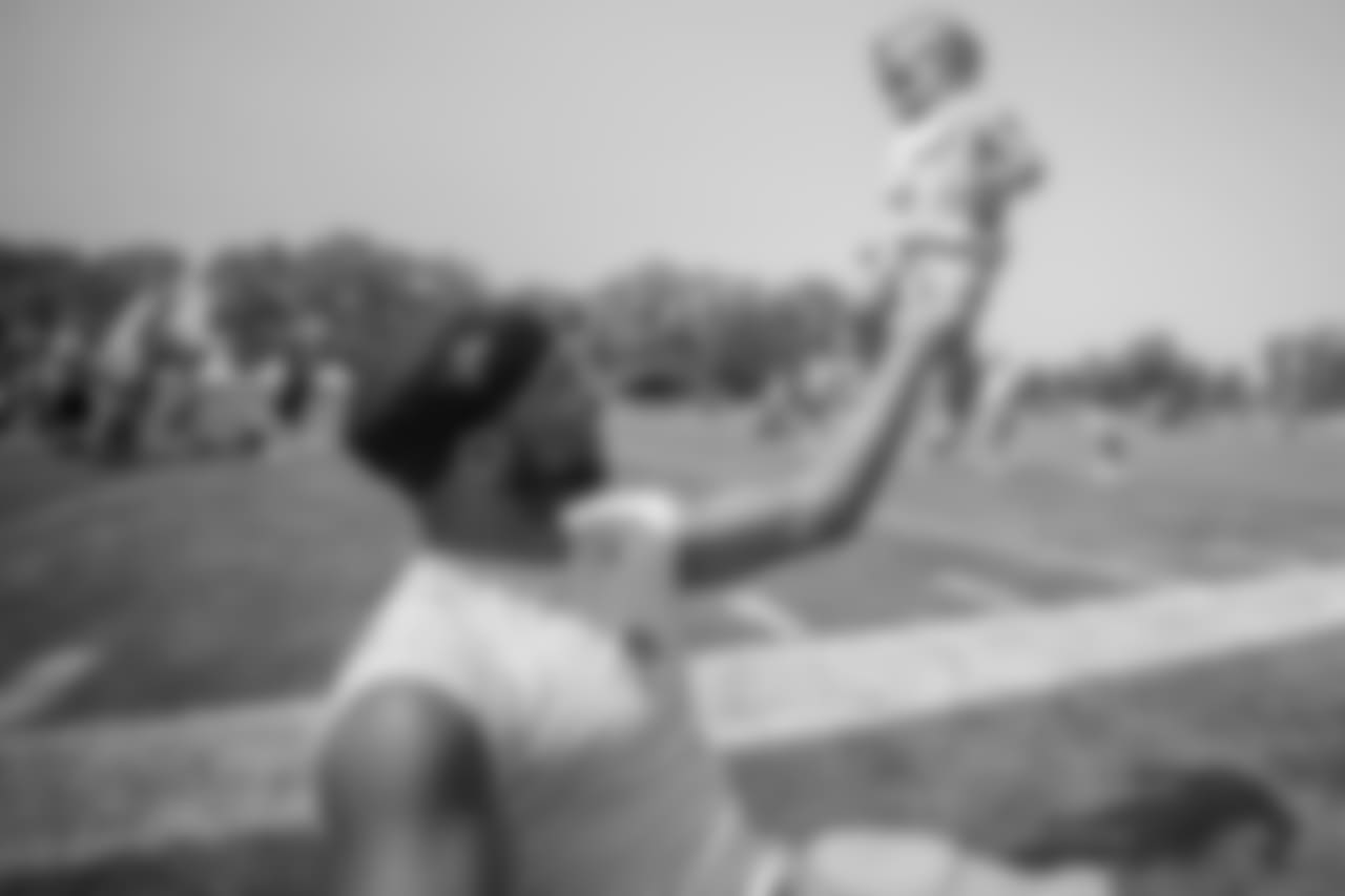 Detroit Lions wide receiver Golden Tate (15) spends time with his family following training camp practice on Tuesday, Aug. 14, 2018 in Allen Park, Mich. (Detroit Lions via AP)