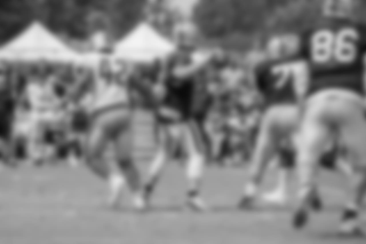 Detroit Lions linebacker Devon Kennard (42) "sacks" Oakland Raiders quarterback Derek Carr (4) during training camp practice on Wednesday, Aug. 8, 2018 in Napa, Calif. (Detroit Lions via AP)