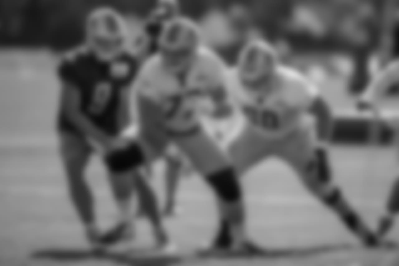 Detroit Lions quarterback Matthew Stafford (9) and offensive lineman Frank Ragnow (77) during training camp practice on Monday, Aug. 13, 2018 in Allen Park, Mich. (Detroit Lions via AP)