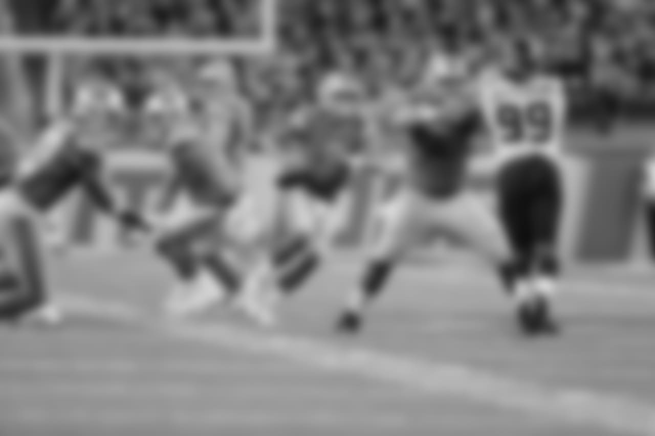 Detroit Lions quarterback Matthew Stafford (9) avoids the rush before throwing a touchdown pass during a NFL football game against the Seattle Seahawks on Sunday, Oct. 28, 2018 in Detroit. (Detroit Lions via AP).