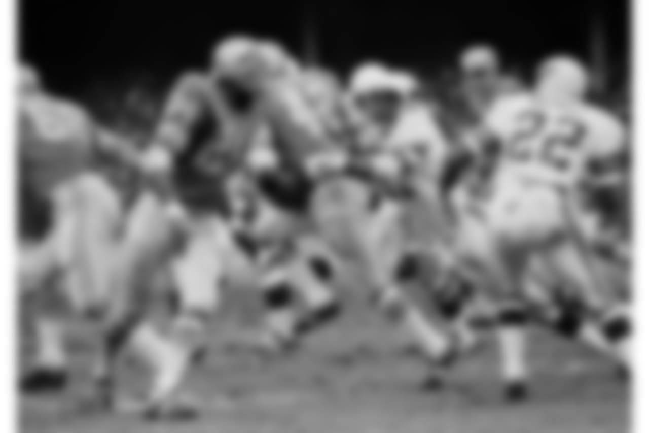 Don Parish (57) with the Cardinals grabs Detroit?s Altie Taylor (42) to stop the Lions with a 5 yd on Dec. 6, 1970 in Detroit. gain in the third quarter of play. (AP Photo/RAS)