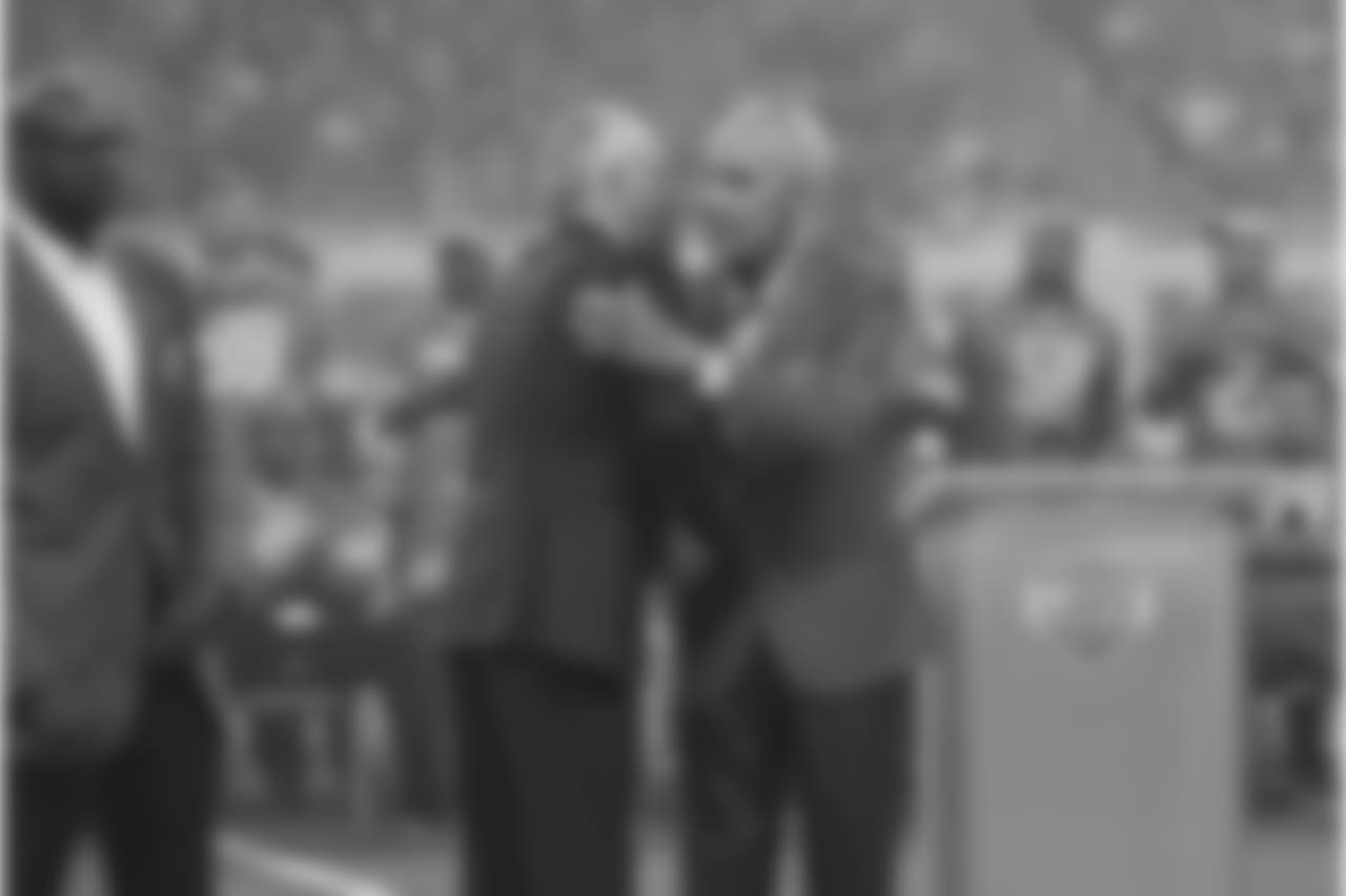 Detroit Lions team president Rod Wood and Roger Brown during the Pride of the Lions induction ceremony at halftime of a NFL football game against the Seattle Seahawks on Sunday, Oct. 28, 2018 in Detroit. (Detroit Lions via AP).