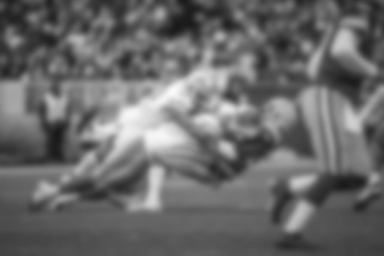 Detroit Lions defensive tackle Damon Harrison (98) and Detroit Lions linebacker Jarrad Davis (40) make a tackle during a NFL football game against the Green Bay Packers on Sunday, Dec. 30, 2018 in Green Bay, Wisc.