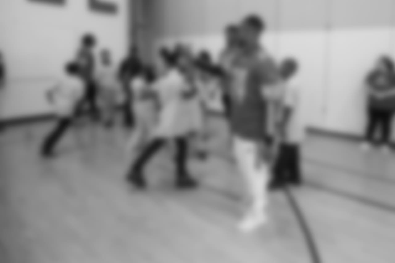 Detroit Lions cornerback Nevin Lawson (24) high fives a student at a real players don't bully assembly with Playworks at Hutchinson Elementary School on Tuesday, Oct. 22, 2018 in Detroit.