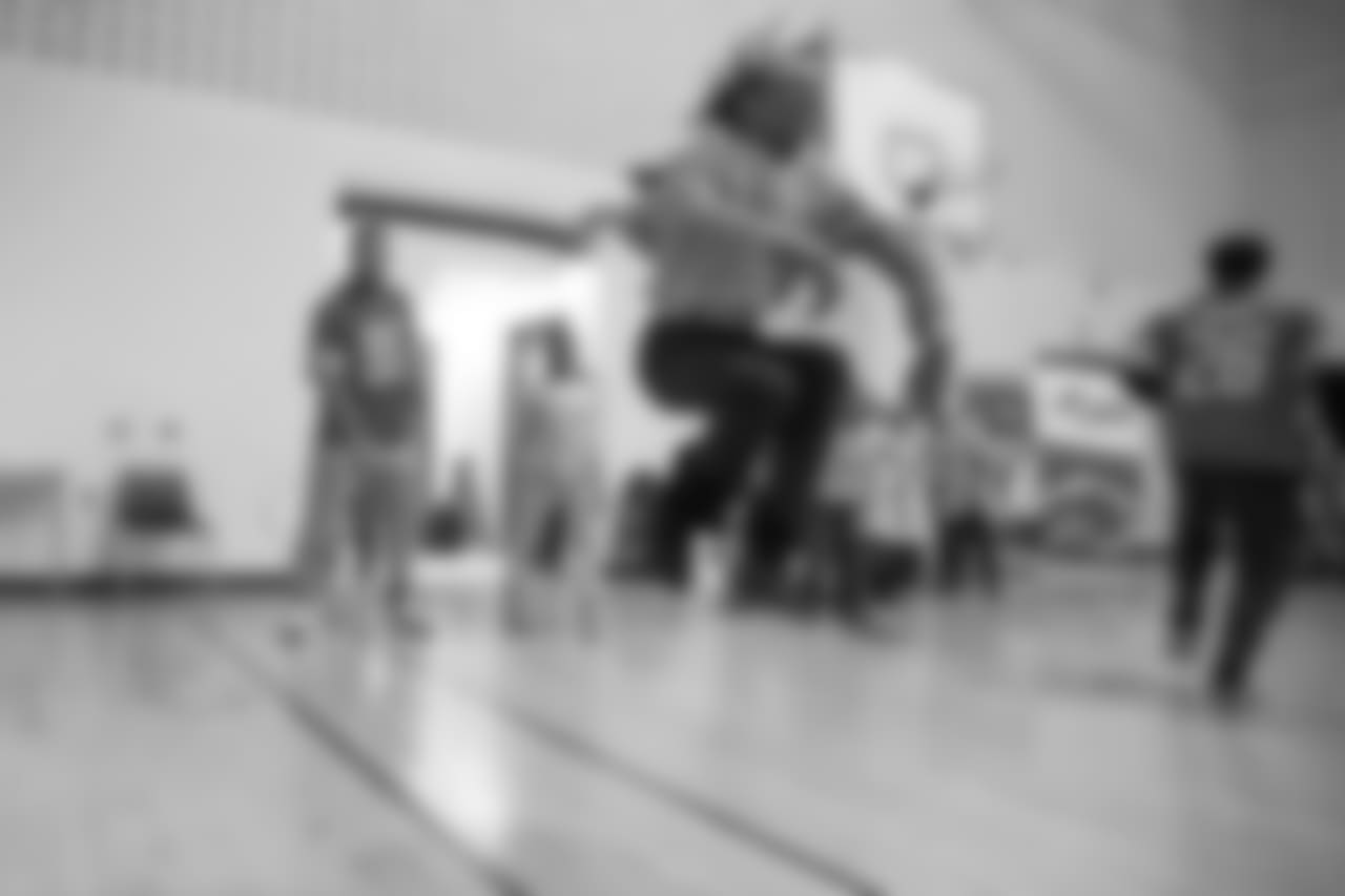 Detroit Lions defensive end Romeo Okwara (95) jumps rope with students at a real players don't bully assembly with Playworks at Hutchinson Elementary School on Tuesday, Oct. 22, 2018 in Detroit.
