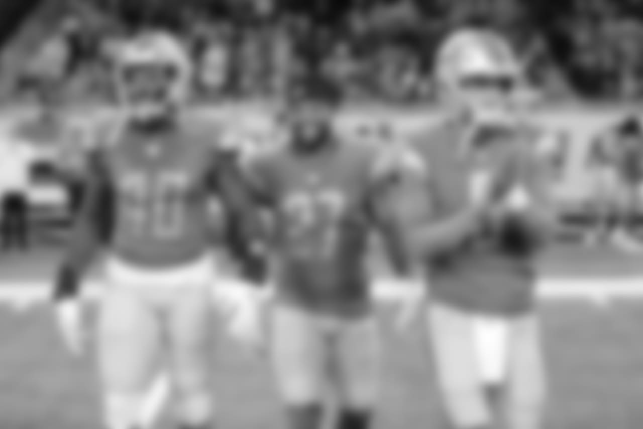 Detroit Lions captains Jarrad Davis (40), Glover Quin (27) and Matthew Stafford (9) during a NFL football game against the Green Bay Packers on Sunday, Oct. 7, 2018 in Detroit. (Detroit Lions via AP).