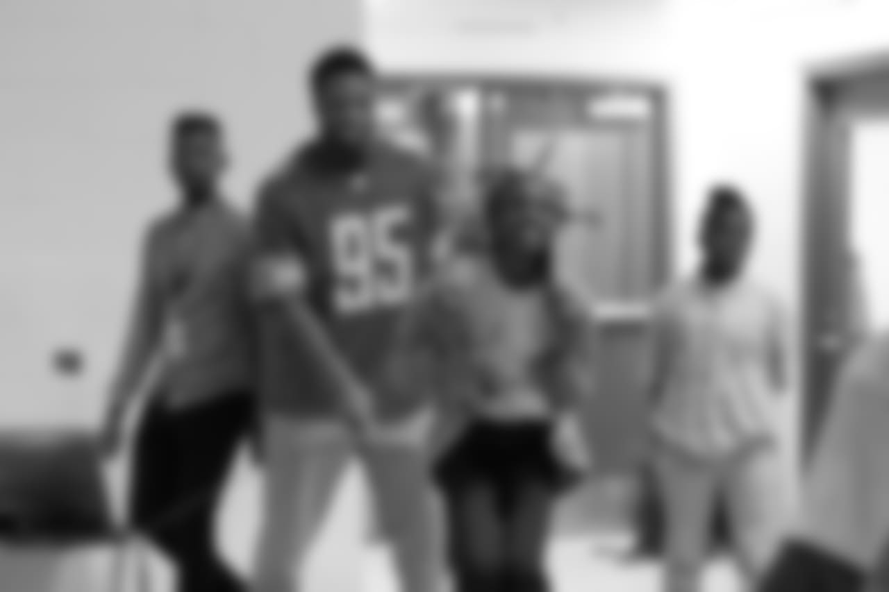 Detroit Lions defensive end Romeo Okwara (95) jump ropes with students at a real players don't bully assembly with Playworks at Hutchinson Elementary School on Tuesday, Oct. 22, 2018 in Detroit.