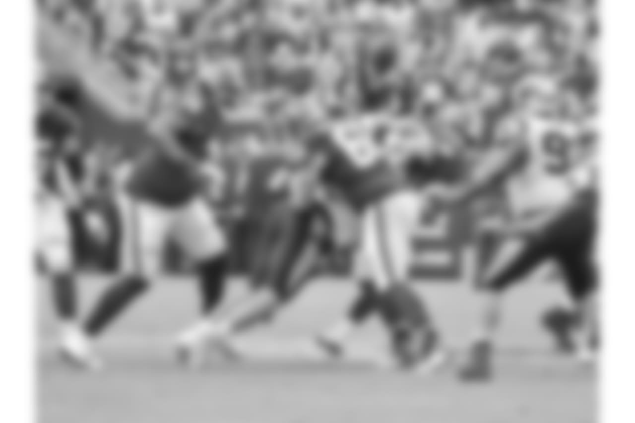 Julius Peppers strip-sacks Alex Smith in a game against Washington in 2018.