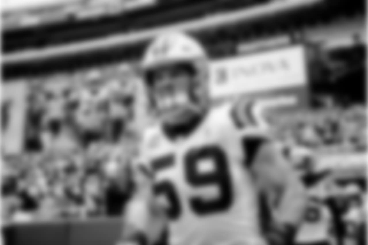 Luke Kuechly runs onto the field during the game against Washington on Sunday, Oct. 14, 2018 at FedEx Field in Landover, MD.