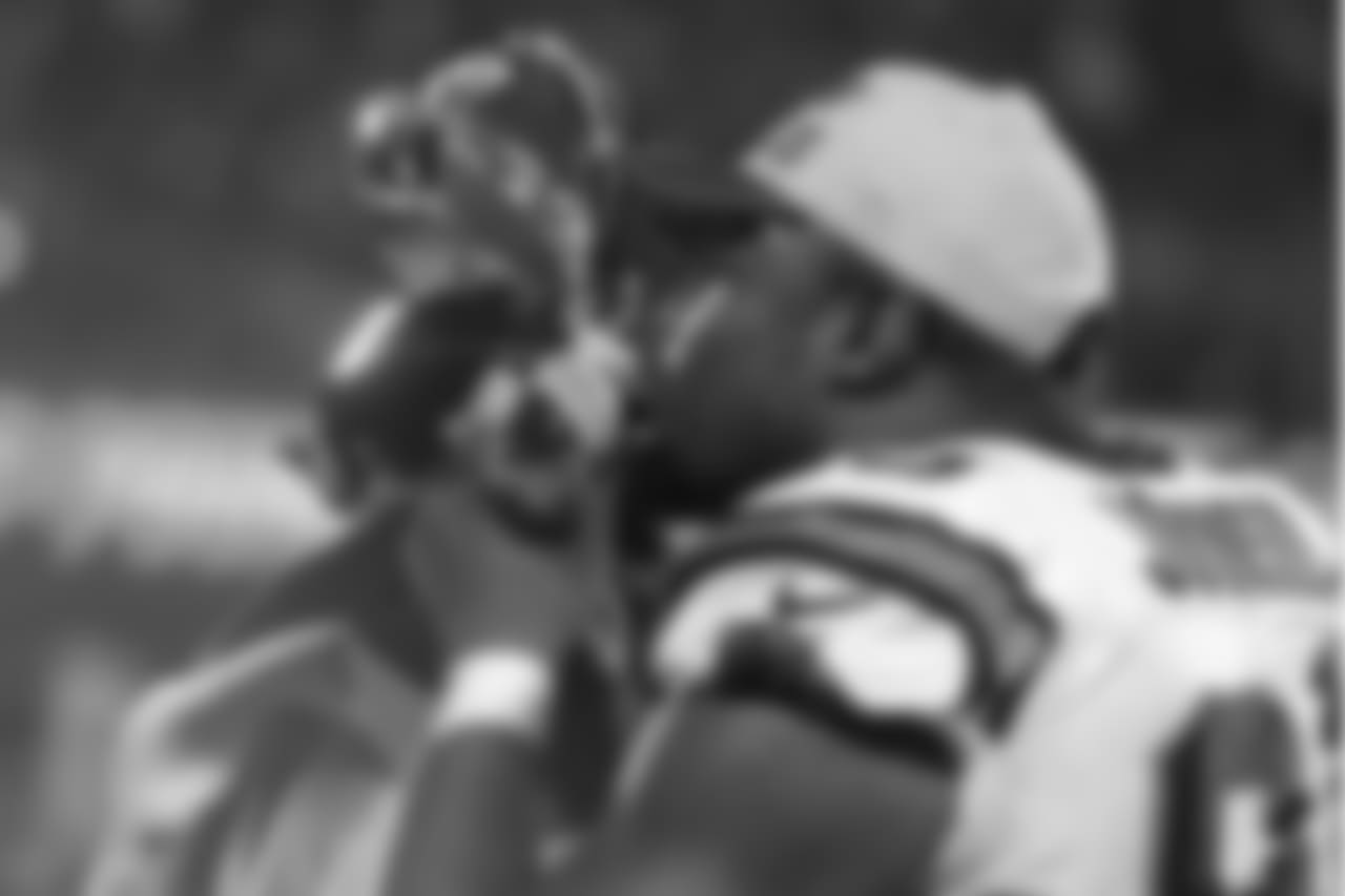 Carolina Panthers defensive end Charles Johnson (95) kisses the George Halas Trophy after the NFC Championship football game against the Arizona Cardinals at Bank of America Stadium in Charlotte, N.C., on Sunday, January 24, 2016. The Panthers won 49-15 and advance to Super Bowl 50. (Perry Knotts via AP)