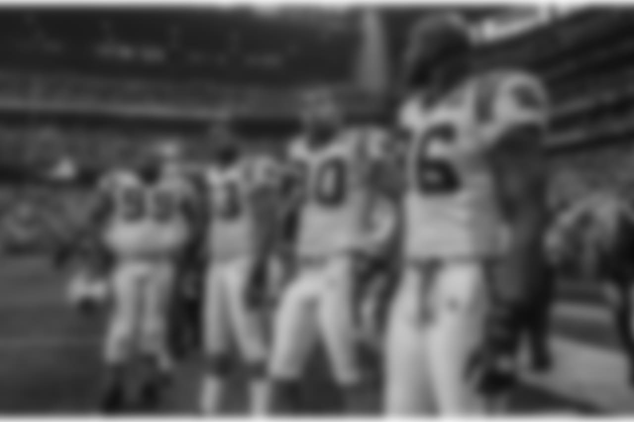 Julius Peppers alongside Brentson Buckner, Mike Rucker and Al Wallace at Super Bowl XXXVIII in 2004.