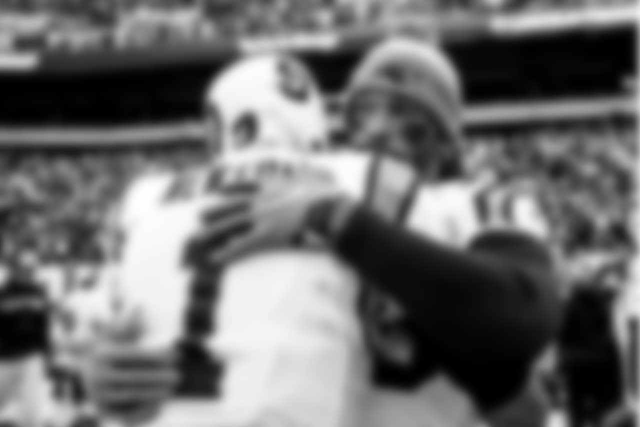 Cam Newton hugs Julius Peppers during a game against the Philadelphia Eagles at Lincoln Financial Field on Sunday, October 21, 2018.