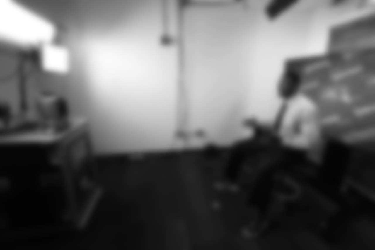 McGinest talks to his co-workers during an NFL Network interview.
