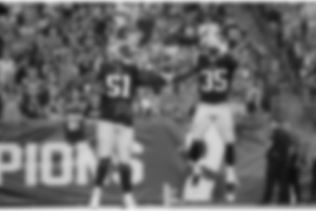 Patriots LB Ja'Whaun Bentley celebrates his fumble return touchdown with CB Keion Crossen