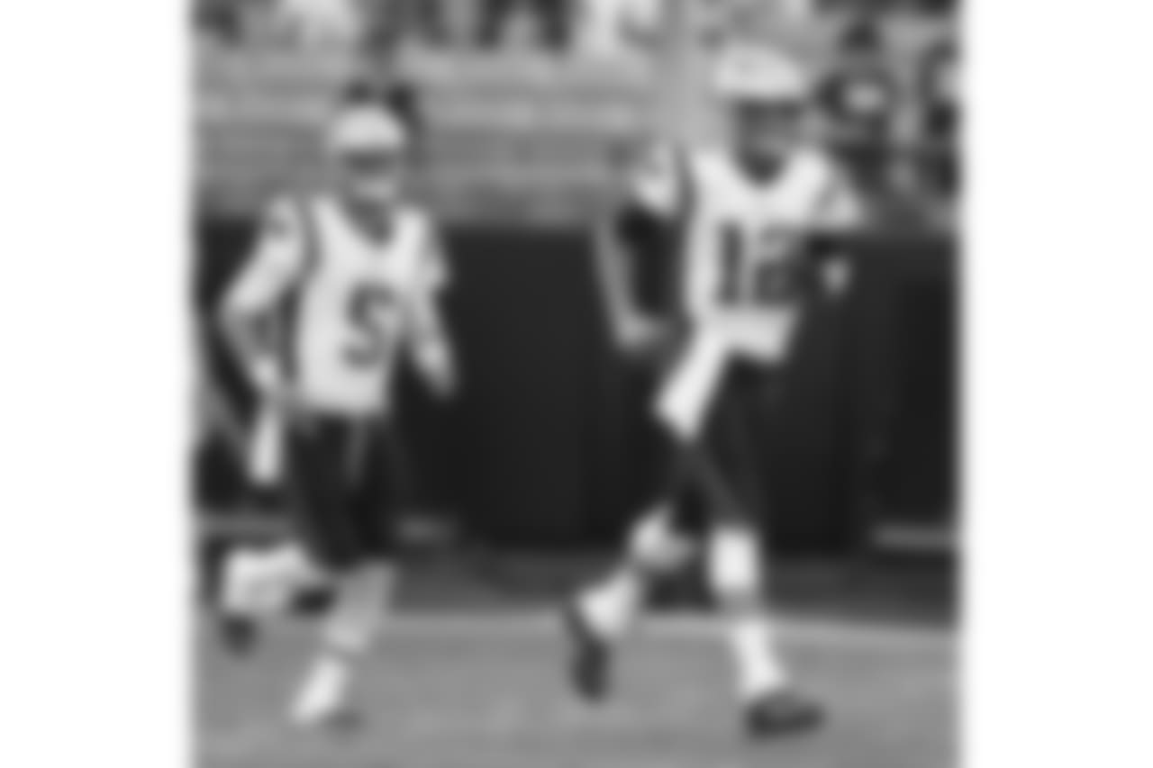 New England Patriots' Tom Brady (12) and Danny Etling (5) takes the field before a preseason NFL football game against the Carolina Panthers in Charlotte, N.C., Friday, Aug. 24, 2018. (AP Photo/Jason E. Miczek)