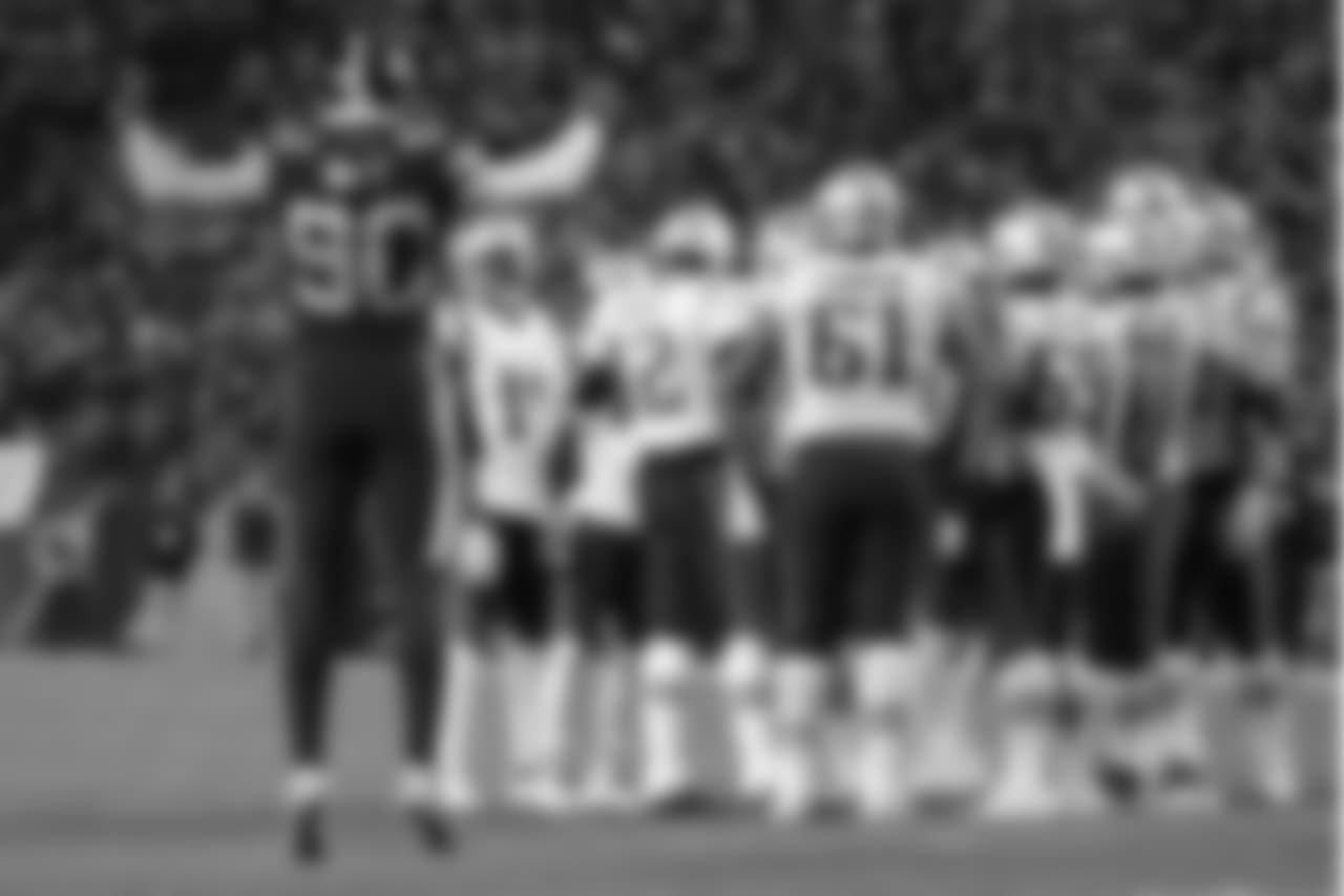 Pittsburgh Steelers outside linebacker T.J. Watt (90) calls the crowd to action as New England Patriots quarterback Tom Brady (12) huddles his team during the second half of an NFL football game in Pittsburgh, Sunday, Dec. 16, 2018. The Steelers won 17-10. (AP Photo/Don Wright)