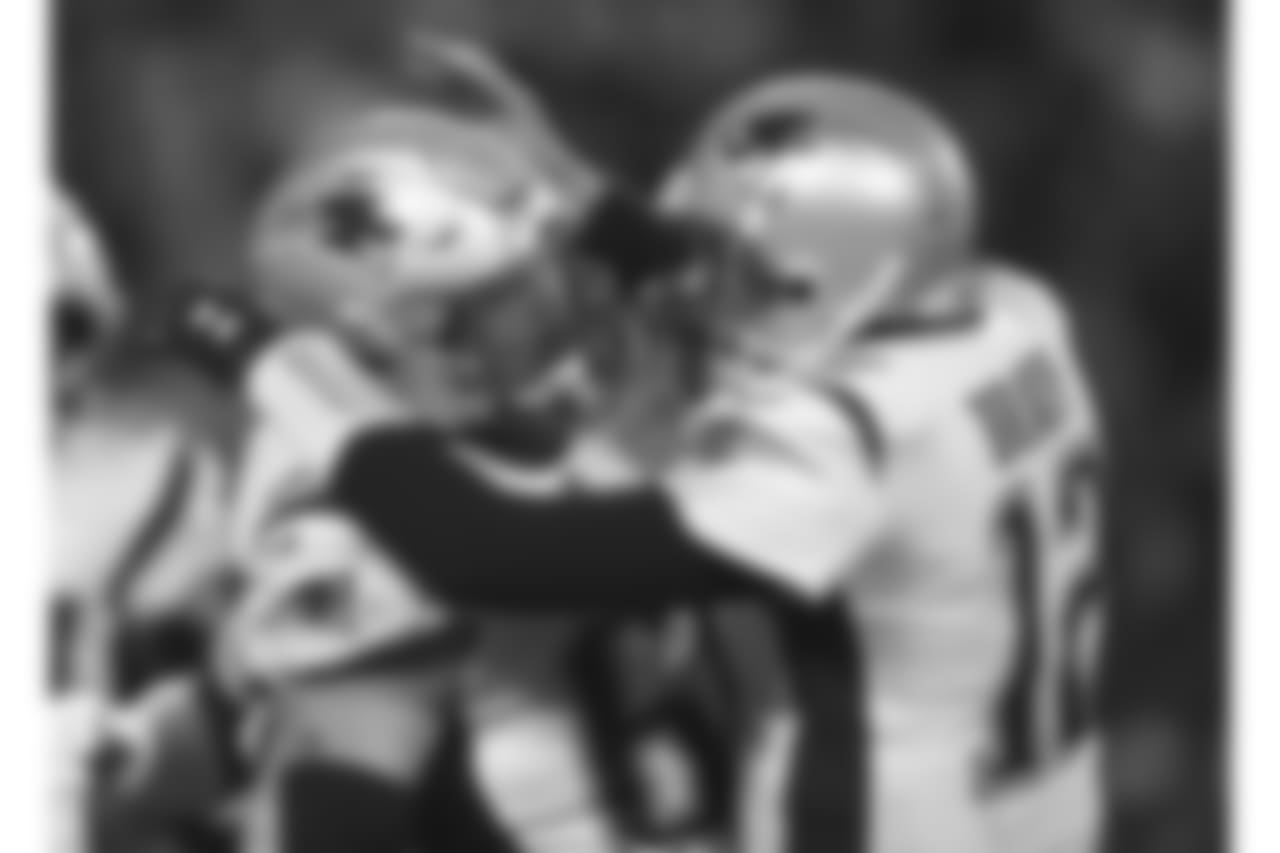 New England Patriots quarterback Tom Brady celebrates with center David Andrews (60) after throwing a touchdown pass to wide receiver Phillip Dorsett during the first half of the AFC Championship NFL football game against the Kansas City Chiefs, Sunday, Jan. 20, 2019, in Kansas City, Mo. (AP Photo/Jeff Roberson)