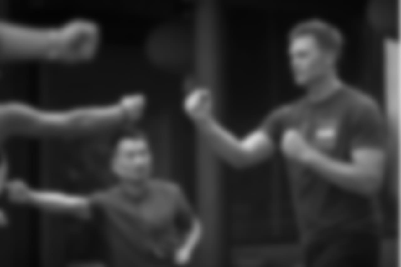 New England Patriots quarterback Tom Brady, right, practices a martial arts technique during a promotional event in Beijing, Sunday, June 18, 2017. The Super Bowl-winning quarterback is on a weeklong promotional tour of China and Japan for a sportswear maker that kicked off on Sunday with a stop in China's capital. (AP Photo/Mark Schiefelbein)