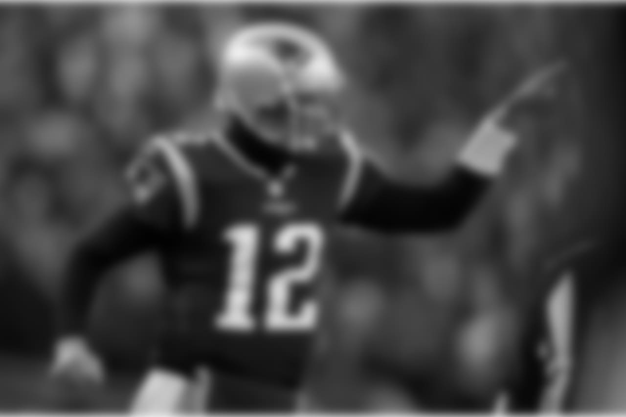 New England Patriots quarterback Tom Brady celebrates one of his team's five first-half touchdowns against the Los Angeles Chargers during the first half of an NFL divisional playoff football game, Sunday, Jan. 13, 2019, in Foxborough, Mass. (AP Photo/Charles Krupa)