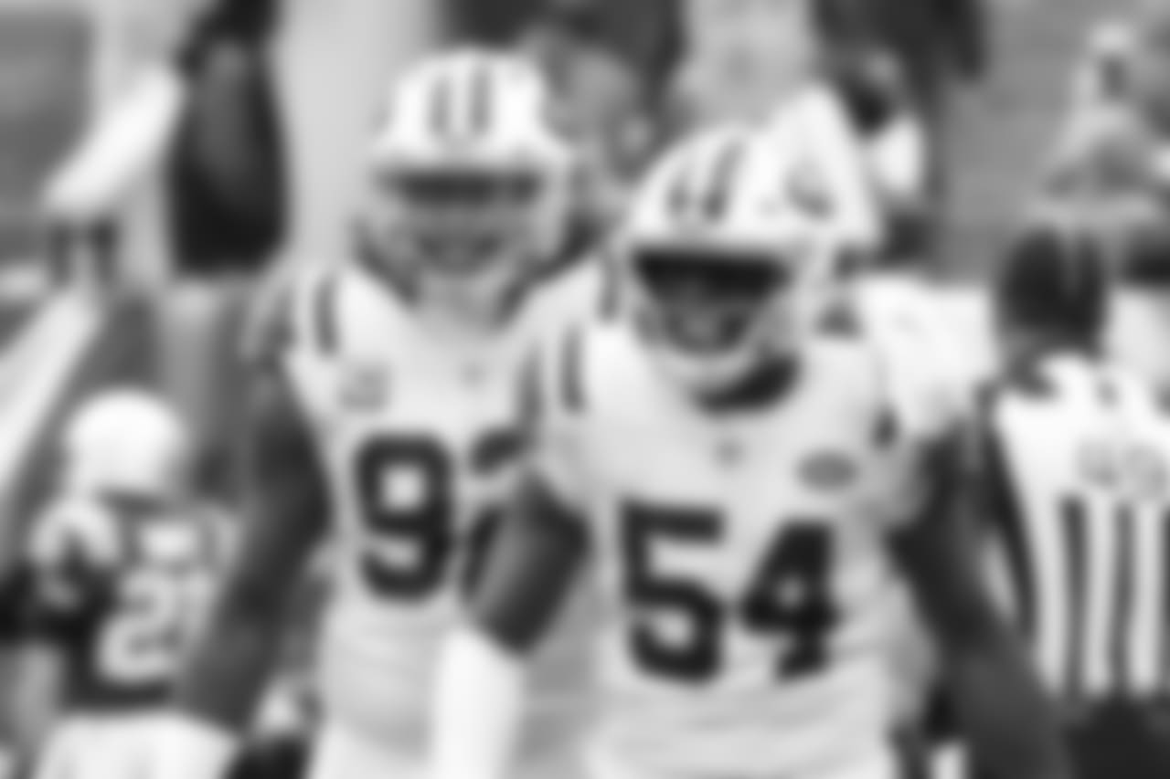 New York Jets inside linebacker Avery Williamson (54) celebrates with defensive end Leonard Williams (92) after Williamson intercepted a pass during the first half of an NFL football game against the Indianapolis Colts, Sunday, Oct. 14, 2018, in East Rutherford, N.J. (AP Photo/Bill Kostroun)