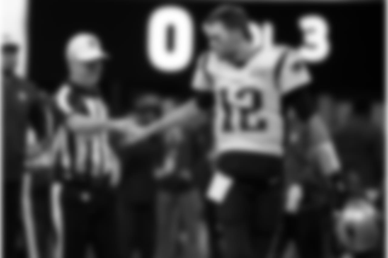 Referee John Parry, left, bumps fists with New England Patriots' Tom Brady before the NFL Super Bowl 53 football game between the Patriots and the Los Angeles Rams, Sunday, Feb. 3, 2019, in Atlanta. (AP Photo/Patrick Semansky)