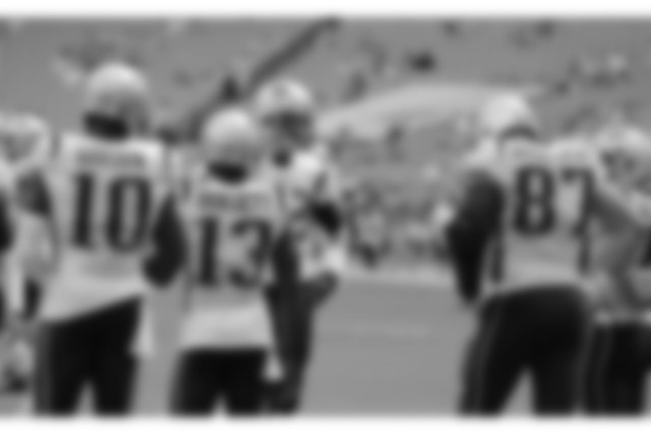 New England Patriots quarterback Tom Brady (12) talks to members of the offensive team, before an NFL football game against the Miami Dolphins, Sunday, Dec. 9, 2018, in Miami Gardens, Fla. (AP Photo/Lynne Sladky)