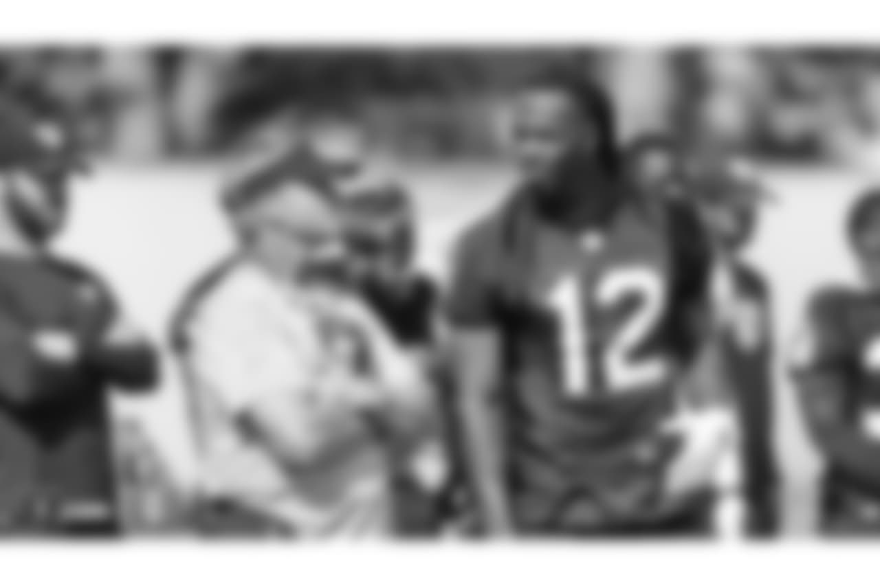 Oakland Raiders head coach Jon Gruden and wide receiver Martavis Bryant (12) on the field for practice at the Oakland Raiders Practice Facility, Monday, October 9, 2018, in Alameda, California.