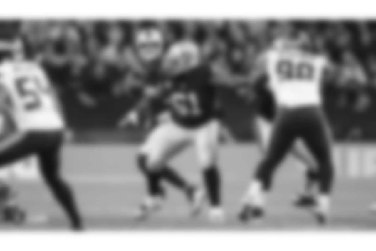 Oakland Raiders quarterback Derek Carr (4) and center Rodney Hudson (61) during the Oakland Raiders regular season game against the Seattle Seahawks at Wembley Stadium, Sunday, October 14, 2018, in London, England. The Oakland Raiders lost 27-3.