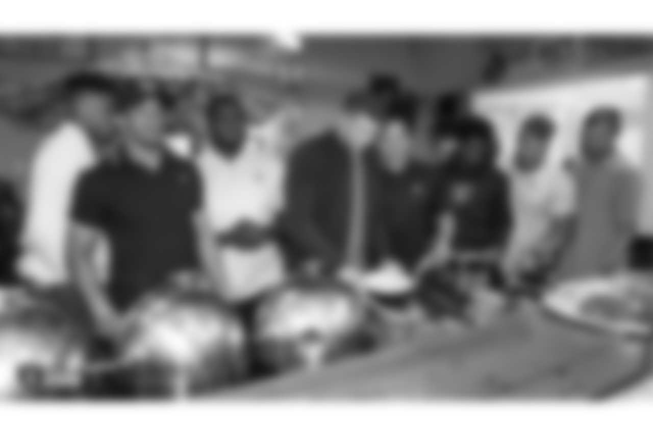 Oakland Raiders rookies share a meal at Everett and Jones BBQ, as part of Rookie Academy, Friday, June 7, 2019, in Oakland, Calif.