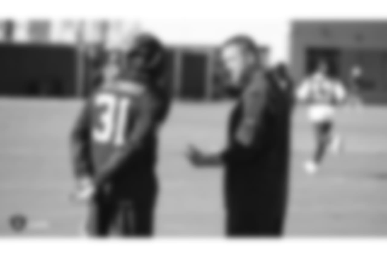 Oakland Raiders safety Marcus Gilchrist (31) and senior defensive assistant Jim O'Neil on the field for a walk through before their game against the Indianapolis Colts, Wednesday, October 31, 2018, in Alameda, California.