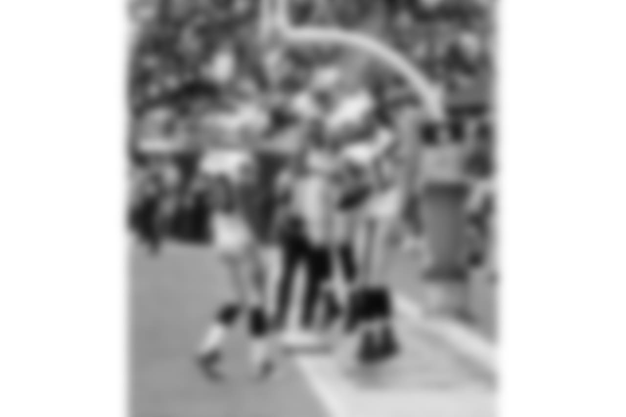 WR Denarius Moore celebrates his TD with TE Mychal Rivera and WR Rod Streater.