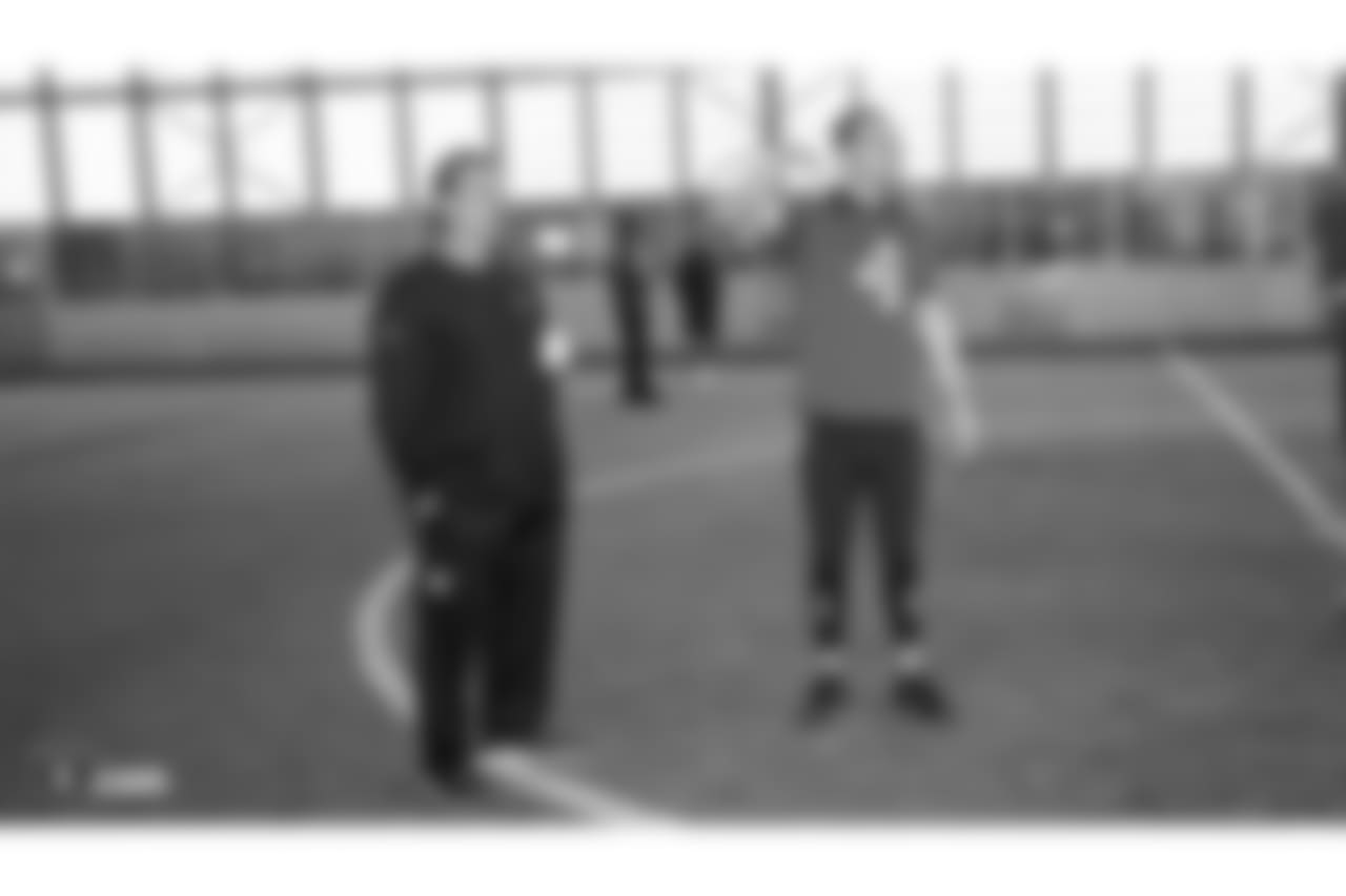 Oakland Raiders offensive coordinator Greg Olson and quarterback Derek Carr (4) on the field for a walk through at Bladium Sports & Fitness, Thursday, November 15, 2018, in Alameda, California.