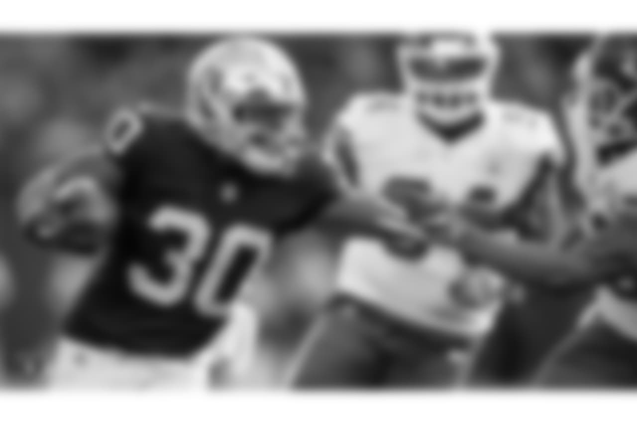 Oakland Raiders running back Jalen Richard (30) rushes for a first down during the Oakland Raiders game against the Kansas City Chiefs at Oakland-Alameda County Coliseum, Sunday, December 2, 2018, in Oakland, California. Oakland lost 40-33.