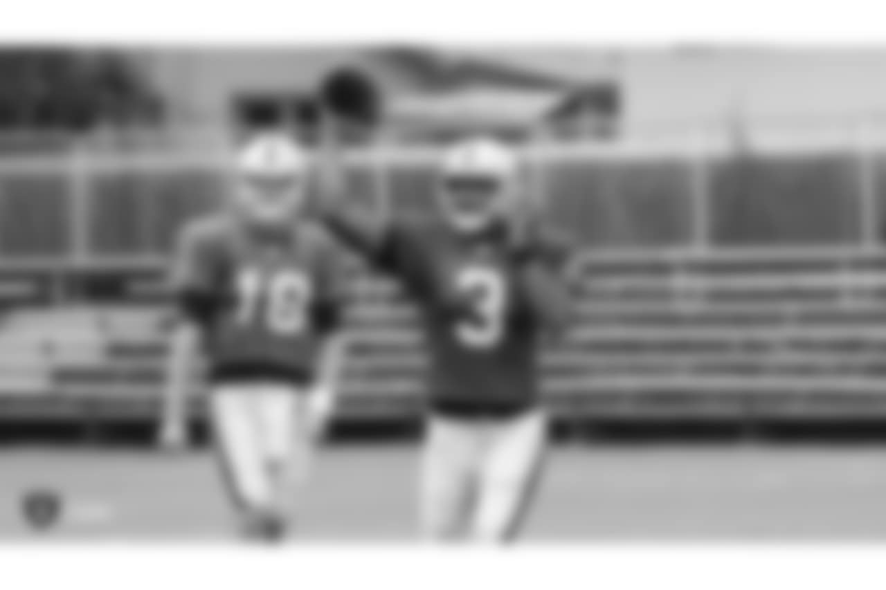 Oakland Raiders quarterback Connor Cook (18) and quarterback EJ Manuel (3) on the field for practice at 2018 Training Camp at The Oakland Raiders Napa Valley Training Complex, Tuesday, August 14, 2018, in Napa, California.