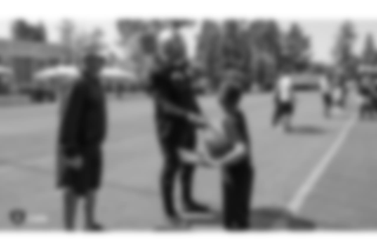 Oakland Raiders running back Marshawn Lynch (24) signs autographs for fans at practice at 2018 Training Camp at The Oakland Raiders Napa Valley Training Complex, Tuesday, August 14, 2018, in Napa, California.