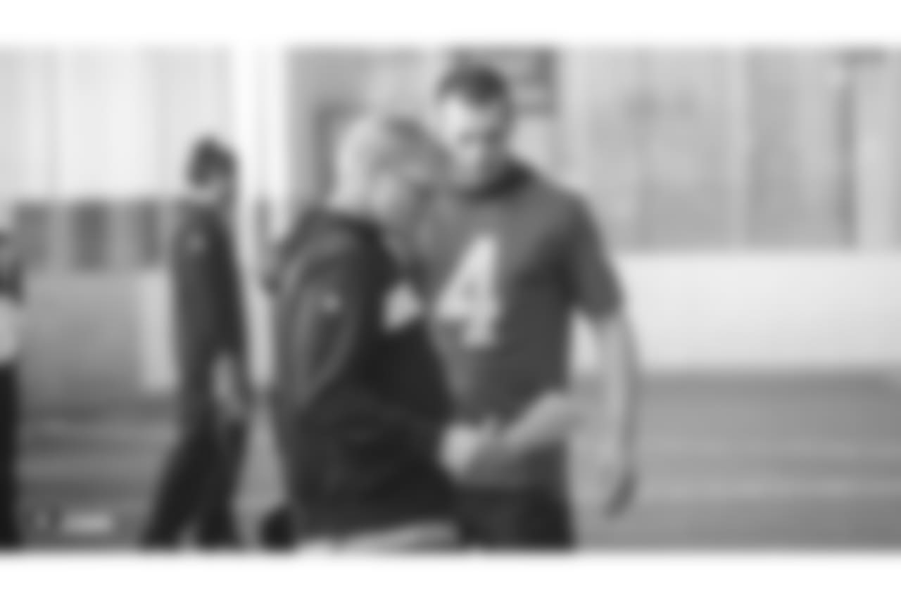 Oakland Raiders head coach Jon Gruden and quarterback Derek Carr (4) on the field for a walk through at Bladium Sports & Fitness, Friday, November 16, 2018, in Alameda, California.