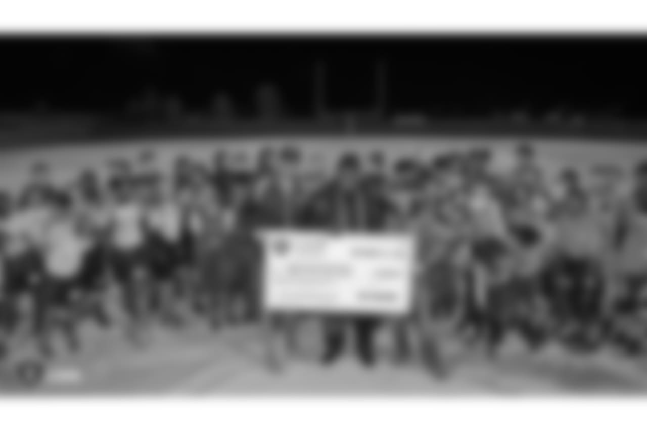 The Clark County District Flag Football league, a collaboration between the Raiders and Clark County School District, is presented with a $20,000 donation from the Raiders, represented by Leo Gray, for new equipment, transportation, officials, and recruiting, Thursday, November 15, 2018, in Las Vegas, Nevada.