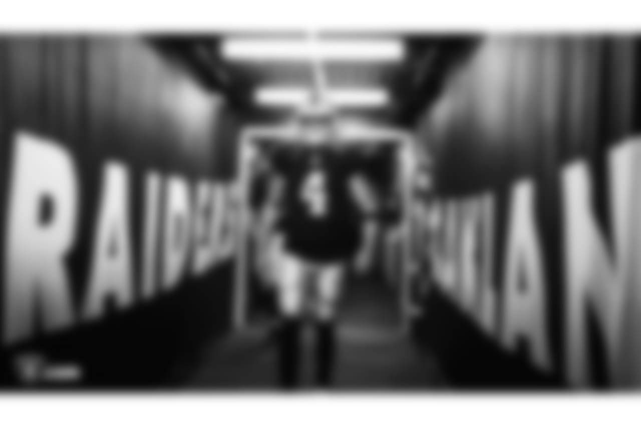 Oakland Raiders quarterback Derek Carr (4) walks down the tunnel before the Oakland Raiders preseason game against the Detroit Lions at Oakland-Alameda County Coliseum, Friday, August 10, 2018, in Oakland, California. The Oakland Raiders won 16-10.