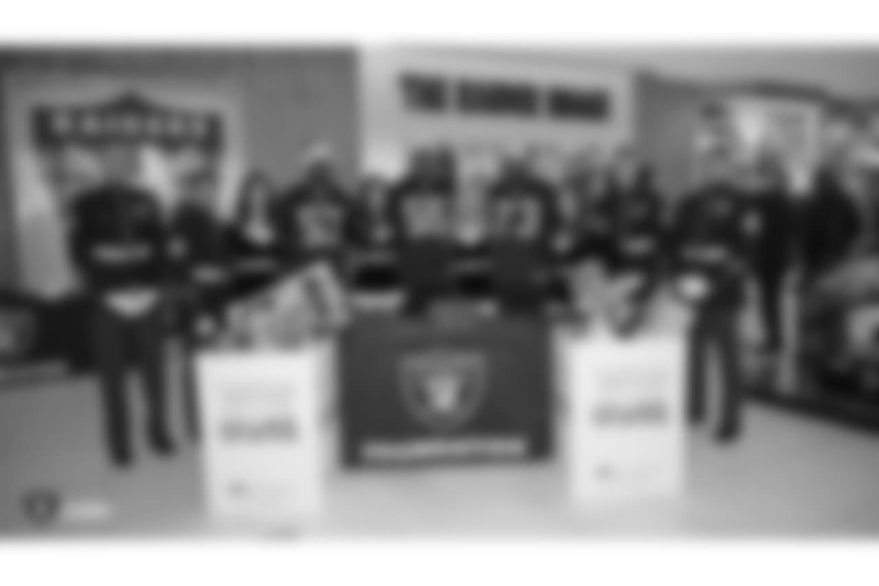 The Raiders Foundation hosts a Toys for Tots drive where guests have the chance to meet Oakland Raiders linebacker Jason Cabinda (53), linebacker Marquel Lee (55), and defensive tackle Maurice Hurst (73) in exchange for a toy or $20 donation to the charity, Tuesday, December 4, 2018, in Hayward, California.