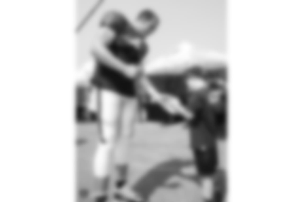 Oakland Raiders quarterback Derek Carr (4) signs autographs for fans after practice at 2018 Training Camp at The Oakland Raiders Napa Valley Training Complex, Friday, August 3, 2018, in Napa, California.